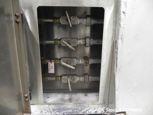 Used Graham Labelling Systems Steam Shrink Tunnel comprised of (2) sections measuring 11'-8" long and 4'-6" long. Opening measures 6" wide x 16" high. Has base for conveyor to accept 4 1/2" wide tabl...