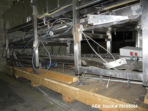 Used Graham Labelling Systems Steam Shrink Tunnel comprised of (2) sections measuring 11'-8" long and 4'-6" long. Opening measures 6" wide x 16" high. Has base for conveyor to accept 4 1/2" wide tabl...