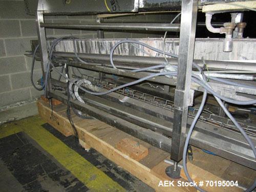 Used Graham Labelling Systems Steam Shrink Tunnel comprised of (2) sections measuring 11'-8" long and 4'-6" long. Opening measures 6" wide x 16" high. Has base for conveyor to accept 4 1/2" wide tabl...