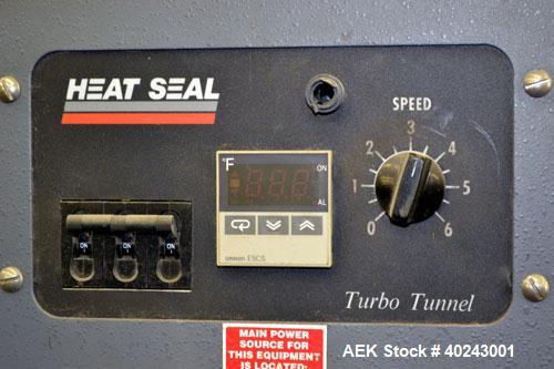 Used Heatseal Turbo Shrink Tunnel, Model T4822/8-LDR, Carbon Steel. 48" Long shrink area. Infeed/discharge opening 22" wide x 8" high. 18" wide x 70" long Teflon mesh conveyor, driven by a 1/8 hp, 13...