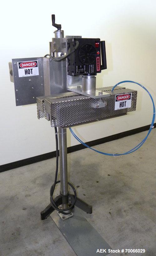 Used Kalish Neck Bander Shrink Tunnel, 3’’ wide x 18’’ long. Includes a Leister hot air blower, model Hotwind S. Maximum air outlet temperature 650 deg C. The Leister is a compact heat gun for proces...