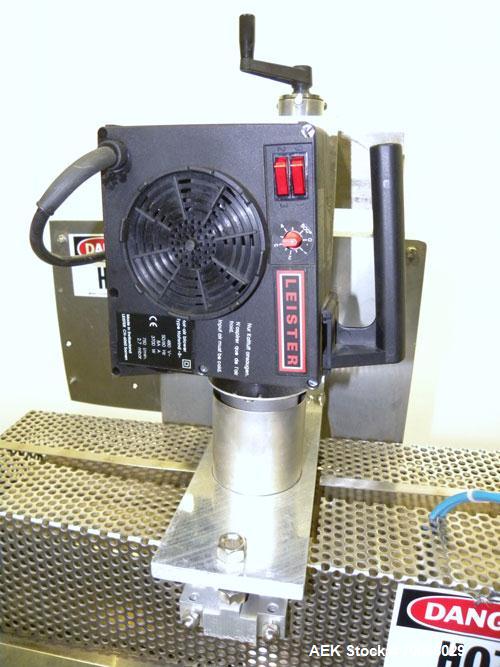 Used Kalish Neck Bander Shrink Tunnel, 3’’ wide x 18’’ long. Includes a Leister hot air blower, model Hotwind S. Maximum air outlet temperature 650 deg C. The Leister is a compact heat gun for proces...