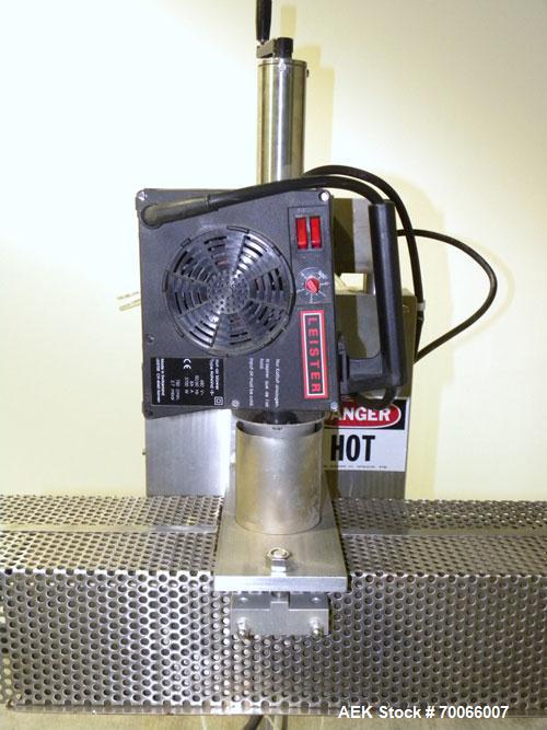 Used Kalish Neck Bander Shrink Tunnel, 4’’ wide x 18’’ long. Includes a Leister hot air blower, model Hotwind S. Maximum air outlet temperature 650 deg C. The Leister is a compact heat gun for proces...