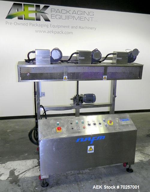 Used NAFM Heat Shrink Tunnel, Model GS-100T, Stainless Steel. Approximate 5’’ wide x 68’’ long heat section, (3) top mounted blowers. 1/2hp Gear motor raise and lower. Mounted on a stainless steel fr...