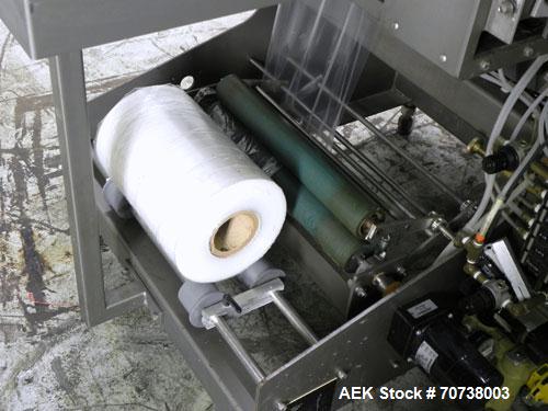 Used Omega Model SL18 Shrink Bundling System with Integrated Shrink Tunnel. Capable of up to 15-20 cycles per minute. Right angle product infeed for 4-1/2”W table top chain, infeed conveyor not inclu...