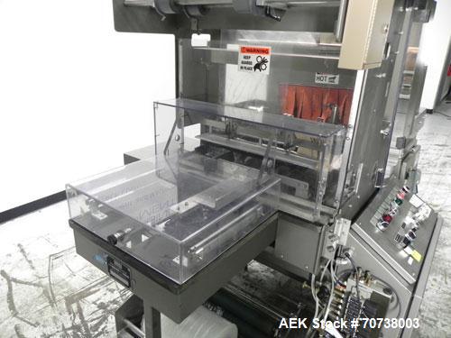 Used Omega Model SL18 Shrink Bundling System with Integrated Shrink Tunnel. Capable of up to 15-20 cycles per minute. Right angle product infeed for 4-1/2”W table top chain, infeed conveyor not inclu...
