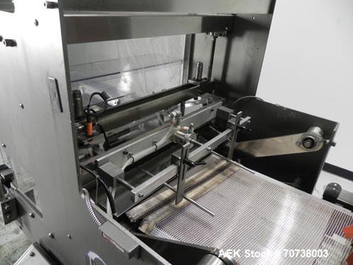 Used Omega Model SL18 Shrink Bundling System with Integrated Shrink Tunnel. Capable of up to 15-20 cycles per minute. Right angle product infeed for 4-1/2”W table top chain, infeed conveyor not inclu...