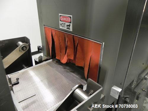 Used Omega Model SL18 Shrink Bundling System with Integrated Shrink Tunnel. Capable of up to 15-20 cycles per minute. Right angle product infeed for 4-1/2”W table top chain, infeed conveyor not inclu...