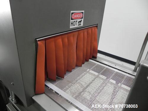 Used Omega Model SL18 Shrink Bundling System with Integrated Shrink Tunnel. Capable of up to 15-20 cycles per minute. Right angle product infeed for 4-1/2”W table top chain, infeed conveyor not inclu...