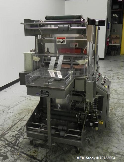 Used Omega Model SL18 Shrink Bundling System with Integrated Shrink Tunnel. Capable of up to 15-20 cycles per minute. Right angle product infeed for 4-1/2”W table top chain, infeed conveyor not inclu...