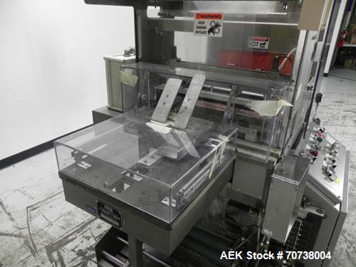 Used Omega Model SL18 Shrink Bundling System with Integrated Shrink Tunnel. Capable of up to 15-20 cycles per minute. Right angle product infeed for 4-1/2”W table top chain, infeed conveyor not inclu...