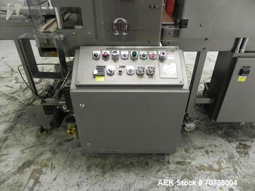 Used Omega Model SL18 Shrink Bundling System with Integrated Shrink Tunnel. Capable of up to 15-20 cycles per minute. Right angle product infeed for 4-1/2”W table top chain, infeed conveyor not inclu...