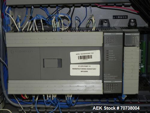Used Omega Model SL18 Shrink Bundling System with Integrated Shrink Tunnel. Capable of up to 15-20 cycles per minute. Right angle product infeed for 4-1/2”W table top chain, infeed conveyor not inclu...