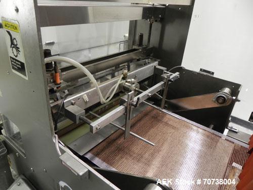 Used Omega Model SL18 Shrink Bundling System with Integrated Shrink Tunnel. Capable of up to 15-20 cycles per minute. Right angle product infeed for 4-1/2”W table top chain, infeed conveyor not inclu...