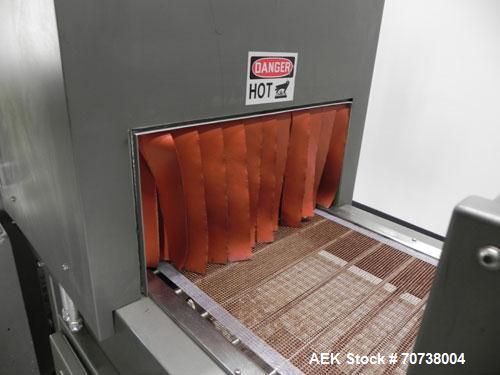 Used Omega Model SL18 Shrink Bundling System with Integrated Shrink Tunnel. Capable of up to 15-20 cycles per minute. Right angle product infeed for 4-1/2”W table top chain, infeed conveyor not inclu...