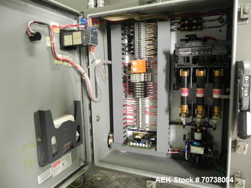 Used Omega Model SL18 Shrink Bundling System with Integrated Shrink Tunnel. Capable of up to 15-20 cycles per minute. Right angle product infeed for 4-1/2”W table top chain, infeed conveyor not inclu...