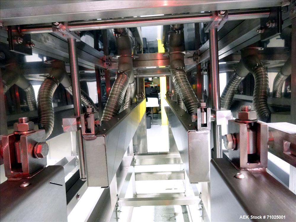 Used Sacmi Sleeve Labeling Electric Heat Tunnel. Has 3 zones, each zone has 72" long x 4.75" tall heater bars, and in/out feed opening of 9.5" wide x 33" tall. Equipped with (3) Leister electric heat...