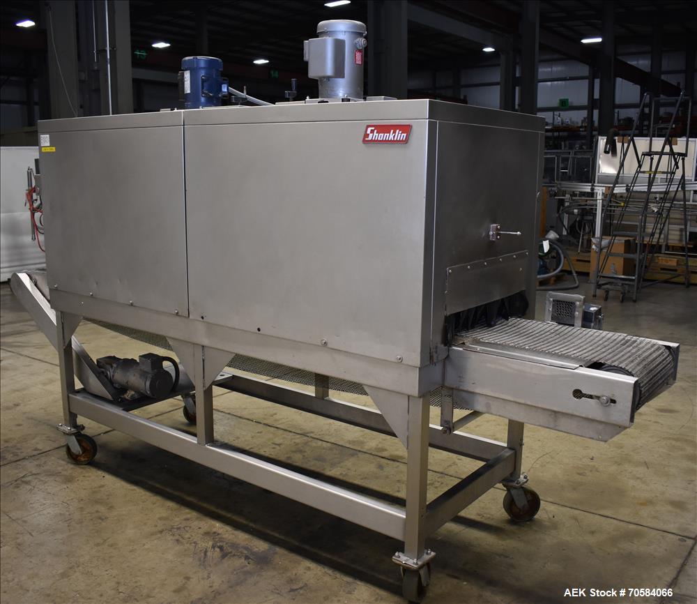 Used Shanklin Model T-72SS Dual Chamber Stainless Steel Shrink Tunnel. Machine is capable of speeds from 25 to 150 linear feet per minute. Unit has tunnel passage dimensions measuring 84" (long) by 2...