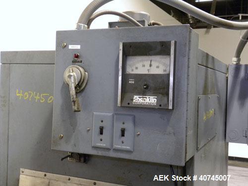 Used Shanklin Shrink Tunnel, Model T-7XL. Machine is of carbon steel construction. Tunnel passage 4’’ to 8" adjustable height x 22" wide x 42" long. 15" wide x 58" long variable speed wire mesh conve...