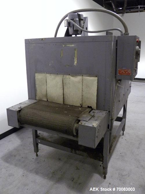Used Shanklin High Capacity Shrink bundler Tunnel, Model T-8, Carbon Steel. Tunnel passage 12" high x 28" wide. Wire mesh belt 24'' wide x 76'' long, 0 to 74 feet per minute, driven by a 1/2 hp, 180 ...