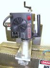 Used Kalish Neck Bander Shrink Tunnel, 3’’ wide x 18’’ long. Includes a Leister hot air blower, model Hotwind S. Maximum air outlet temperature 650 deg C. The Leister is a compact heat gun for proces...