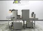 Used Omega Model SL18 Shrink Bundling System with Integrated Shrink Tunnel. Capable of up to 15-20 cycles per minute. Right angle product infeed for 4-1/2”W table top chain, infeed conveyor not inclu...