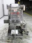 Used Omega Model SL18 Shrink Bundling System with Integrated Shrink Tunnel. Capable of up to 15-20 cycles per minute. Right angle product infeed for 4-1/2”W table top chain, infeed conveyor not inclu...