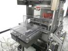 Used Omega Model SL18 Shrink Bundling System with Integrated Shrink Tunnel. Capable of up to 15-20 cycles per minute. Right angle product infeed for 4-1/2”W table top chain, infeed conveyor not inclu...