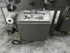 Used Omega Model SL18 Shrink Bundling System with Integrated Shrink Tunnel. Capable of up to 15-20 cycles per minute. Right angle product infeed for 4-1/2”W table top chain, infeed conveyor not inclu...