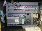 Used Omega Model SL18 Shrink Bundling System with Integrated Shrink Tunnel. Capable of up to 15-20 cycles per minute. Right angle product infeed for 4-1/2”W table top chain, infeed conveyor not inclu...