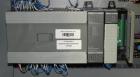 Used Omega Model SL18 Shrink Bundling System with Integrated Shrink Tunnel. Capable of up to 15-20 cycles per minute. Right angle product infeed for 4-1/2”W table top chain, infeed conveyor not inclu...