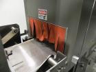 Used Omega Model SL18 Shrink Bundling System with Integrated Shrink Tunnel. Capable of up to 15-20 cycles per minute. Right angle product infeed for 4-1/2”W table top chain, infeed conveyor not inclu...