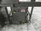Used Omega Model SL18 Shrink Bundling System with Integrated Shrink Tunnel. Capable of up to 15-20 cycles per minute. Right angle product infeed for 4-1/2”W table top chain, infeed conveyor not inclu...