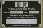 Used Omega Model SL18 Shrink Bundling System with Integrated Shrink Tunnel. Capable of up to 15-20 cycles per minute. Right angle product infeed for 4-1/2”W table top chain, infeed conveyor not inclu...