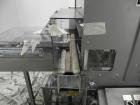 Used Omega Model SL18 Shrink Bundling System with Integrated Shrink Tunnel. Capable of up to 15-20 cycles per minute. Right angle product infeed for 4-1/2”W table top chain, infeed conveyor not inclu...