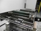 Used Omega Model SL18 Shrink Bundling System with Integrated Shrink Tunnel. Capable of up to 15-20 cycles per minute. Right angle product infeed for 4-1/2”W table top chain, infeed conveyor not inclu...