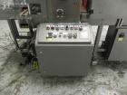 Used Omega Model SL18 Shrink Bundling System with Integrated Shrink Tunnel. Capable of up to 15-20 cycles per minute. Right angle product infeed for 4-1/2”W table top chain, infeed conveyor not inclu...