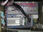 Used Omega Model SL18 Shrink Bundling System with Integrated Shrink Tunnel. Capable of up to 15-20 cycles per minute. Right angle product infeed for 4-1/2”W table top chain, infeed conveyor not inclu...