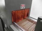 Used Omega Model SL18 Shrink Bundling System with Integrated Shrink Tunnel. Capable of up to 15-20 cycles per minute. Right angle product infeed for 4-1/2”W table top chain, infeed conveyor not inclu...