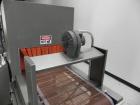 Used Omega Model SL18 Shrink Bundling System with Integrated Shrink Tunnel. Capable of up to 15-20 cycles per minute. Right angle product infeed for 4-1/2”W table top chain, infeed conveyor not inclu...