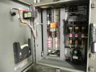 Used Omega Model SL18 Shrink Bundling System with Integrated Shrink Tunnel. Capable of up to 15-20 cycles per minute. Right angle product infeed for 4-1/2”W table top chain, infeed conveyor not inclu...