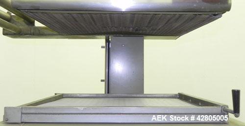 Used Ampak Shipmate II Model SF-1824A Vacuum Skin Packager. Has an 18” wide x 24” long platen size with an adjustable platen clearance of 6” to 18”. Film capacity 20” wide x 9” OD on 3” ID core. Plat...