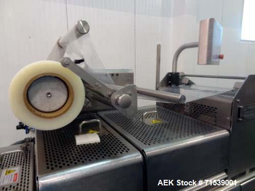 Used Multivac Darfresh Skin Packaging System, Model R175 CD. 220 volt, 3-phase, 60 Hz, 82 amp, 14.5 kW. 420mm bottom web  semi rigid. 250mm advance, 20" loading area, 14 ft. long overall. Film trim w...
