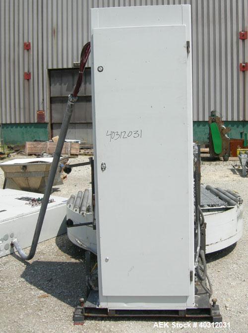 Used Infra-Pak Side Winder Automatic Stretch Wrapper, model CTA. 90" diameter turntable, counter clockwise rotation, 48" x 54" x 60" high x 20" wide film, 4000 pound load capacity. Driven by a 1 hp, ...