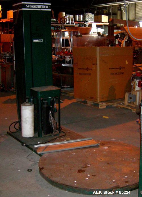 Used Infra Pak Sidewinder Platform Stretch Wrapper. Maximum load 3000 pounds. 5' diameter turntable, approximate 6' wrap height, average cycle time 2 minutes. Table driven by an approximate 1/2 hp ge...