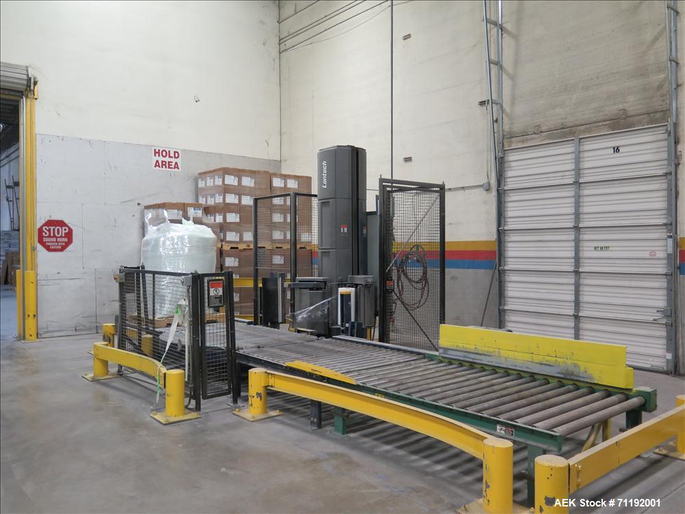 Used Lantech Stretch Wrapper, Model Q1000 Serial # QA 002180.  Automatic operation with powered infeed and discharge pallet conveyors, 18" elevation.   Max 92" load height (incl pallet), Max 4,000 lb...