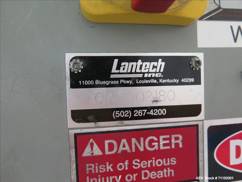 Used Lantech Stretch Wrapper, Model Q1000 Serial # QA 002180.  Automatic operation with powered infeed and discharge pallet conveyors, 18" elevation.   Max 92" load height (incl pallet), Max 4,000 lb...