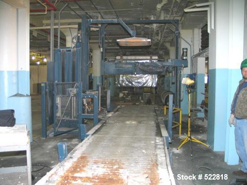 USED: Lantech stretch wrapper, series converted, products model SHASP.               Unit complete with Allen Bradley PLC, 10' powered chain driven live roller conveyor, auto stretch wrapping complet...