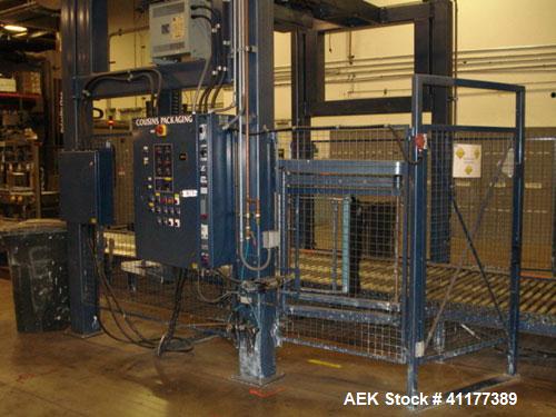 Used Cousins Automatic Stretch Wrapper, Model 7100-65-OHA. The Series 7100 fully automatic conveyorized overhead spiral stretch wrap systems will wrap up to 95 loads per hour, maximum load size 50” w...