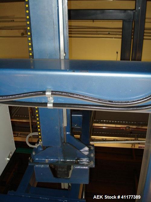 Used Cousins Automatic Stretch Wrapper, Model 7100-65-OHA. The Series 7100 fully automatic conveyorized overhead spiral stretch wrap systems will wrap up to 95 loads per hour, maximum load size 50” w...